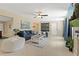 Cozy living room featuring a plush blue sofa, modern art, and neutral color scheme at 2708 Fort Worth St, Sarasota, FL 34231