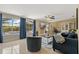 Bright living room featuring large windows, stylish curtains, and comfortable seating arrangements at 2708 Fort Worth St, Sarasota, FL 34231