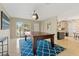 Living room with blue accent rug and adjacent open kitchen at 2708 Fort Worth St, Sarasota, FL 34231