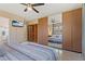 Main bedroom with ceiling fan, closet, and en suite bath at 2708 Fort Worth St, Sarasota, FL 34231