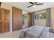 Main bedroom with ceiling fan, closet, and curtains at 2708 Fort Worth St, Sarasota, FL 34231