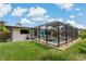 Inviting screened-in pool with patio furniture, great for relaxing and enjoying the outdoors at 2708 Fort Worth St, Sarasota, FL 34231