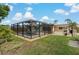 Screened-in pool and patio area with modern outdoor furniture, perfect for entertaining at 2708 Fort Worth St, Sarasota, FL 34231