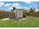 Well-maintained shed for extra storage, surrounded by a lush lawn and privacy fence at 2708 Fort Worth St, Sarasota, FL 34231