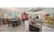 Beautiful kitchen flowing into an open concept dining and living area, perfect for entertaining guests at 2932 Upper Tangelo Dr, Sarasota, FL 34239