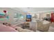 Cozy living room featuring large windows, comfortable furniture, and stylish rug at 2932 Upper Tangelo Dr, Sarasota, FL 34239