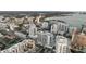 Scenic aerial view shows a city with high-rise buildings and the sea in the background at 301 Quay Commons # 503, Sarasota, FL 34236