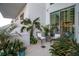 Spacious balcony filled with lush greenery and comfortable seating area at 301 Quay Commons # 503, Sarasota, FL 34236