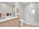 Modern bathroom with a glass-enclosed shower, sleek vanity, and contemporary fixtures at 301 Quay Commons # 503, Sarasota, FL 34236