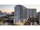 Modern high-rise condo building with street-level retail spaces and beautiful landscaped surroundings at 301 Quay Commons # 503, Sarasota, FL 34236