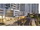 Modern condo building with street view of parking entrance and businesses at the ground level at 301 Quay Commons # 503, Sarasota, FL 34236