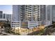 Detailed shot of the high-rise condo exterior with luxurious balconies and commercial space below at 301 Quay Commons # 503, Sarasota, FL 34236