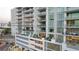 Exterior view of a high-rise building with multiple balconies and modern architectural design at 301 Quay Commons # 503, Sarasota, FL 34236