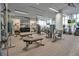 Modern gym features state-of-the-art equipment, multiple ceiling fans, and natural light at 301 Quay Commons # 503, Sarasota, FL 34236