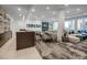 Spacious lounge area with bar, couch, and dining space perfect for entertaining and relaxing at 301 Quay Commons # 503, Sarasota, FL 34236