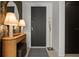 Front entry showcasing a decorative console table and accent mirror at 301 Quay Commons # 611, Sarasota, FL 34236