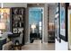 Hallway featuring a built-in bookshelf at 301 Quay Commons # 611, Sarasota, FL 34236