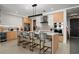 Modern kitchen with sleek cabinetry, stainless steel appliances, and an island with bar seating at 301 Quay Commons # 611, Sarasota, FL 34236