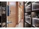 Walk-in closet with accent lighting and custom boxes at 301 Quay Commons # 611, Sarasota, FL 34236