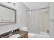 Well-lit bathroom with granite countertop vanity and a shower and tub combination at 3350 S Osprey Ave # 211A, Sarasota, FL 34239