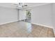 Bedroom with tiled floors and sliding glass doors leading to the outdoor balcony at 3350 S Osprey Ave # 211A, Sarasota, FL 34239
