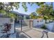 The Oasis on Osprey gated condominium entrance with lush tropical landscaping at 3350 S Osprey Ave # 211A, Sarasota, FL 34239