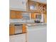 A well-equipped kitchen features granite countertops, stainless steel appliances and wood cabinetry at 3350 S Osprey Ave # 211A, Sarasota, FL 34239