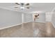 Spacious living room with tile flooring and neutral paint, open to kitchen at 3350 S Osprey Ave # 211A, Sarasota, FL 34239