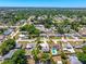 An aerial view of a neighborhood with houses and green trees showing the property's location at 3427 Cambridge Dr, Sarasota, FL 34232