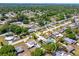 Overview of a neighborhood featuring a property with a gray roof and surrounding residential area at 3427 Cambridge Dr, Sarasota, FL 34232