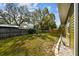 Well-maintained backyard with a wooden fence and partial garden area, offering privacy at 3427 Cambridge Dr, Sarasota, FL 34232