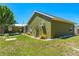 Spacious backyard featuring a garden with blooming roses, offering a private outdoor oasis at 3427 Cambridge Dr, Sarasota, FL 34232