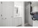 Compact bathroom featuring a standing shower and integrated sink and cabinet at 3427 Cambridge Dr, Sarasota, FL 34232