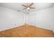 Bright bedroom featuring hardwood floors, a ceiling fan, and a closet at 3427 Cambridge Dr, Sarasota, FL 34232