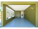 A well-lit covered carport offers ample space and easy access to the home's entrance at 3427 Cambridge Dr, Sarasota, FL 34232