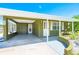 The front exterior features a covered carport with access to the home's entrance at 3427 Cambridge Dr, Sarasota, FL 34232