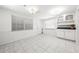 Bright dining area featuring tiled floors, white walls, and ample natural light at 3427 Cambridge Dr, Sarasota, FL 34232
