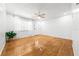 Bright living room with hardwood floors, a ceiling fan, and natural light at 3427 Cambridge Dr, Sarasota, FL 34232