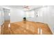 Bright living room with hardwood floors, a ceiling fan, and natural light at 3427 Cambridge Dr, Sarasota, FL 34232