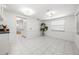 Bright living room with tile floors and a view of the kitchen at 3427 Cambridge Dr, Sarasota, FL 34232