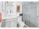 Modern bathroom featuring a vanity with storage, a toilet, and a glass-enclosed shower at 3500 El Conquistador Pkwy # 117, Bradenton, FL 34210
