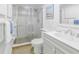 Clean bathroom with toilet, sink, and fully enclosed glass shower at 3500 El Conquistador Pkwy # 117, Bradenton, FL 34210