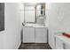 Efficient laundry room with washer, dryer, and water heater, providing convenience for household chores at 3500 El Conquistador Pkwy # 117, Bradenton, FL 34210