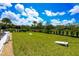 Expansive backyard featuring lush grass and ample space for outdoor activities like cornhole at 3803 Savanna Palms Ct, Bradenton, FL 34211