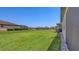 Large backyard with beautiful green grass at 3803 Savanna Palms Ct, Bradenton, FL 34211