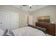 This bedroom features carpet, a closet, a dresser with a TV, and a comfortable queen size bed at 3803 Savanna Palms Ct, Bradenton, FL 34211