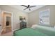 This bedroom features carpet, a bright window, and two comfortable twin beds at 3803 Savanna Palms Ct, Bradenton, FL 34211