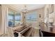Bright dining area featuring modern decor, large windows, and sliding glass door to outdoor space at 3803 Savanna Palms Ct, Bradenton, FL 34211