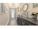 Stylish entryway with wood floors, decorative accents, and a charming 'Gather Together' sign at 3803 Savanna Palms Ct, Bradenton, FL 34211