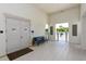 Entrance to the fitness center with a bench and a view of the pool at 3803 Savanna Palms Ct, Bradenton, FL 34211